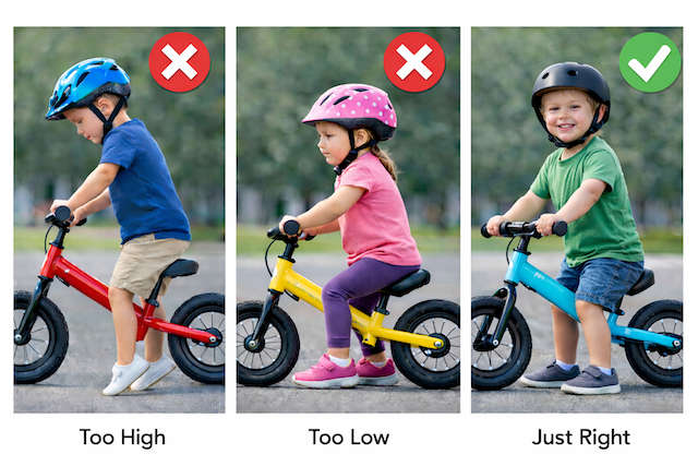 toddler on balance bike with feet flat on the ground and slight bend in knees showing correct seat height
